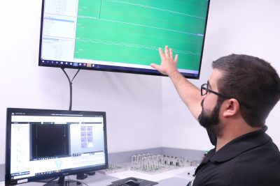 man looking at screen for medical manufacturing
