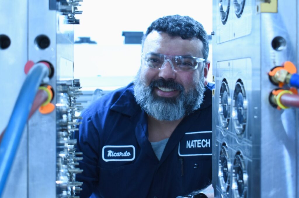 Technician reviewing an open mold after evaluation and setup for production readiness