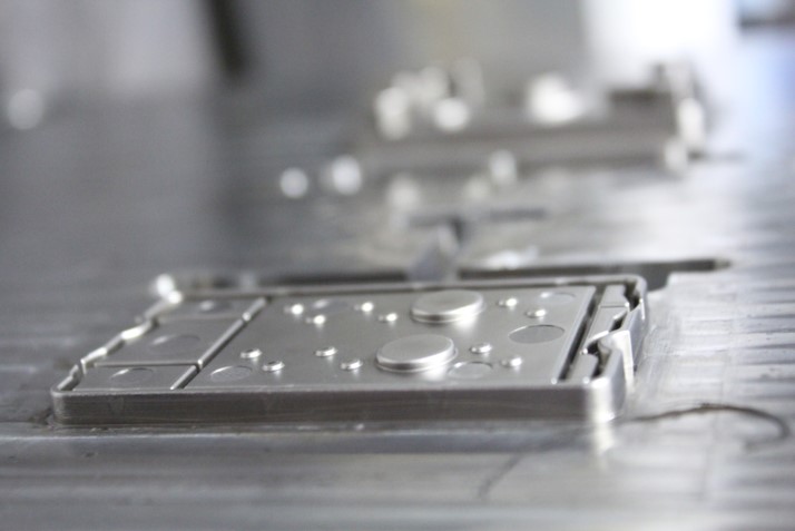 Precision injection mold with machined components designed for manufacturability and repeatable production
